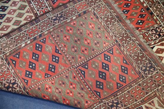 A Turkoman red ground rug, 6ft 2in by 3ft 7in.